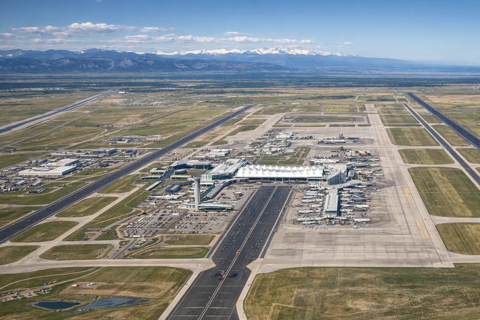 Aerial view of Denver International Airport showcasing its large land area and runways. How Big is Denver Airport